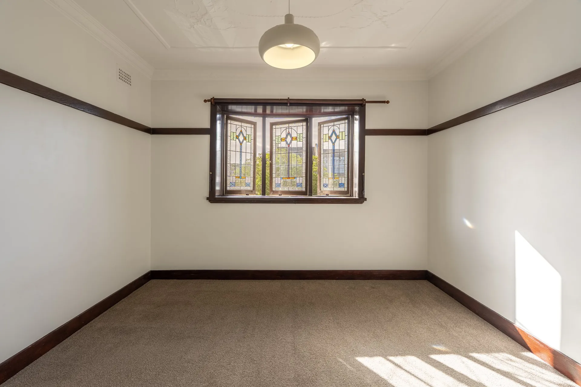 Randwick room with stained-glass bay window