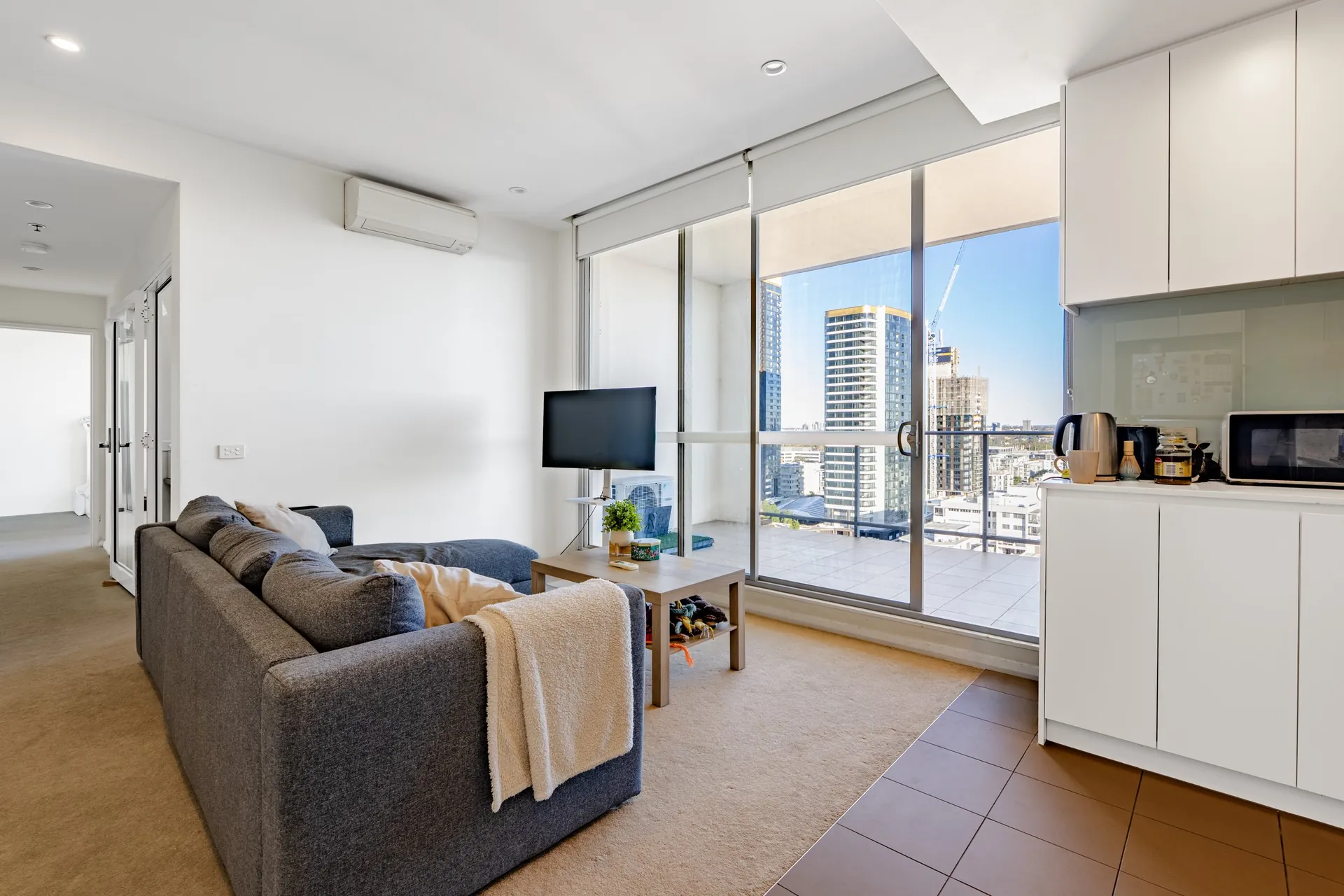 Rhodes apartment living room with city outlook